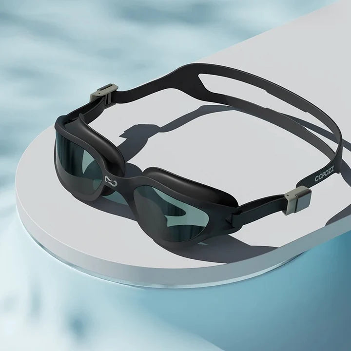 A pair of professional anti-fog mirrored swimming goggles with adjustable silicone strap and UV protection
