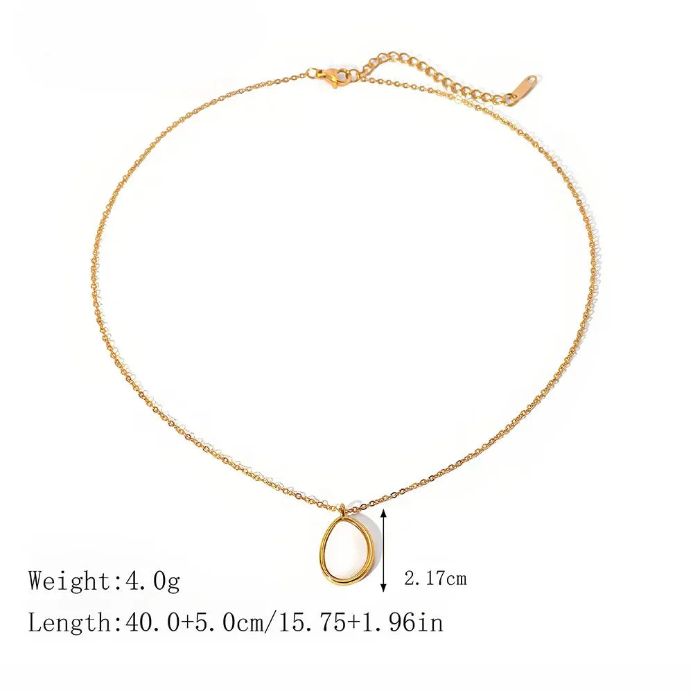 A luxury opal inlaid stainless steel drop pendant necklace with a 18K gold plating, showcasing a captivating and sophisticated design.