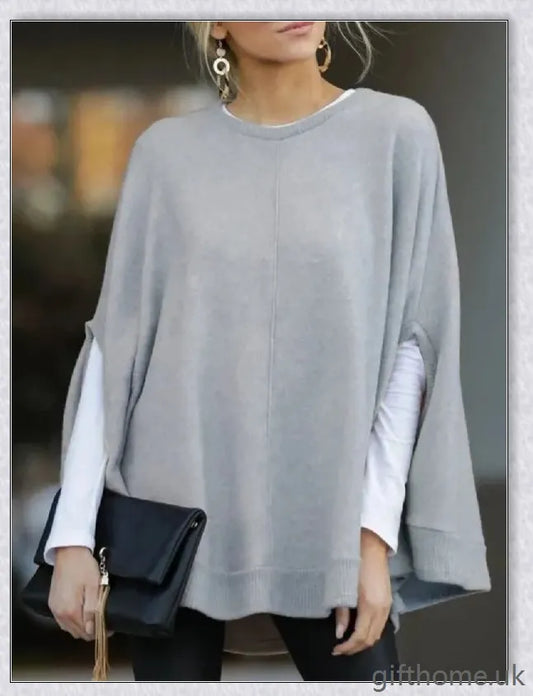A cosy and stylish knitted bat sleeve poncho top in a relaxed, elegant silhouette