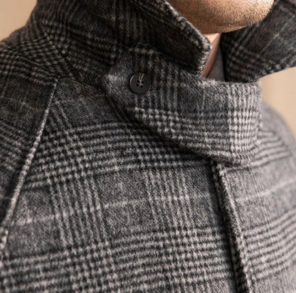Men's wool-blend mid-length coat in a classic black grey colour, featuring a tailored silhouette and premium details for sophisticated winter style.