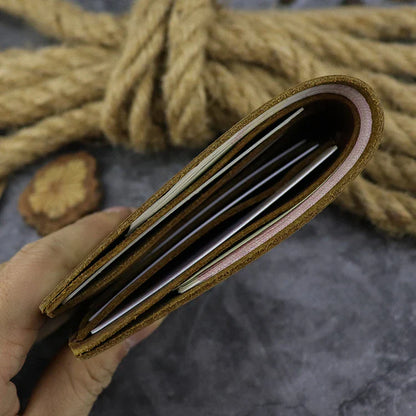 A close-up view of a premium leather wallet in a light brown colour, featuring a single money clip and multiple card slots for organised storage of essentials.