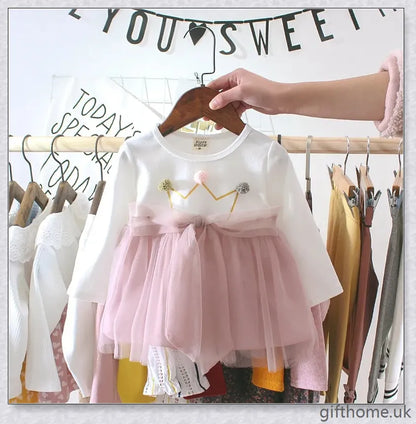 Soft, premium cotton baby girl dress with charming bow detail and cosy corduroy fabric