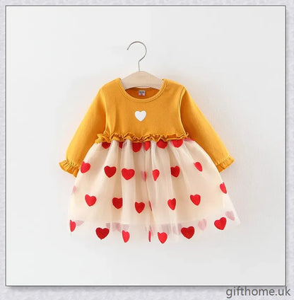 Soft, premium cotton baby girl dress with charming bow detail and cosy corduroy fabric