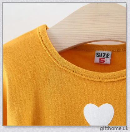 Soft, premium cotton baby girl dress with charming bow detail and cosy corduroy fabric