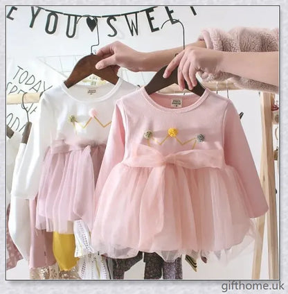 Soft, premium cotton baby girl dress with charming bow detail and cosy corduroy fabric