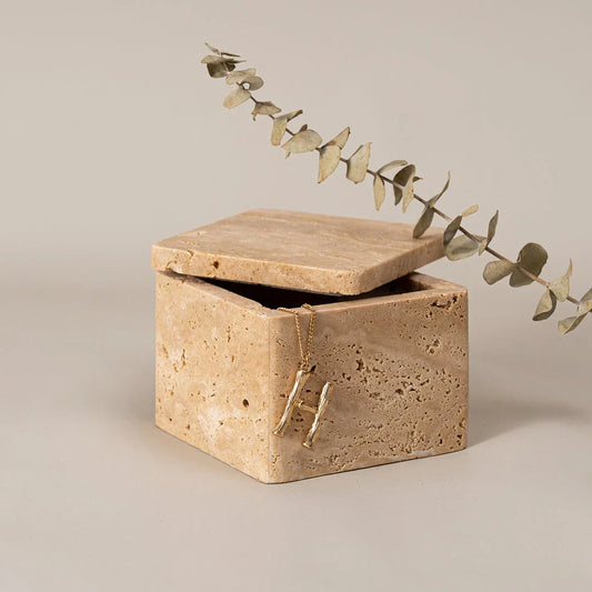 Beige natural travertine stone storage box with lid, featuring a sleek, square design and Scandinavian-inspired aesthetic