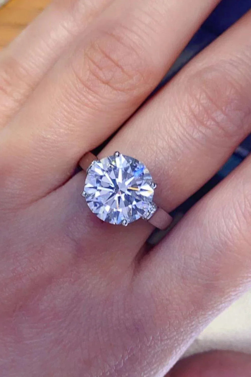 Shimmering 5 carat moissanite ring with platinum-plated setting and zircon accents