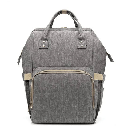 Multi-purpose large capacity mummy bag in blue, with a sleek backpack-inspired design and ample storage for parenting essentials