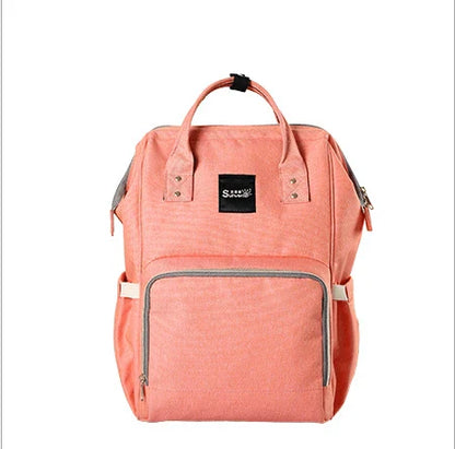 Multi-purpose large capacity mummy bag in blue, with a sleek backpack-inspired design and ample storage for parenting essentials