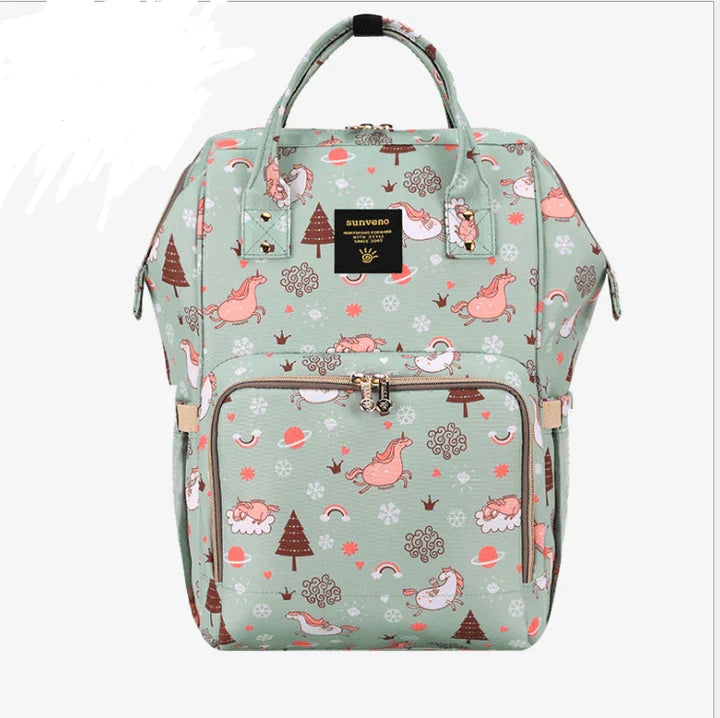 Multi-purpose large capacity mummy bag in blue, with a sleek backpack-inspired design and ample storage for parenting essentials