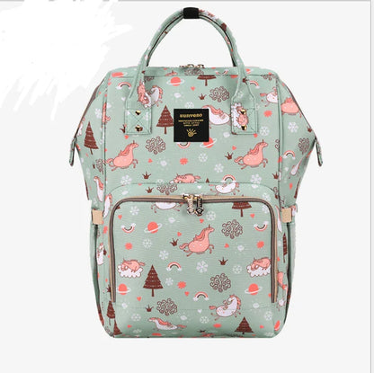 Multi-purpose large capacity mummy bag in blue, with a sleek backpack-inspired design and ample storage for parenting essentials