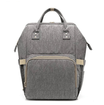 Multi-purpose large capacity mummy bag in blue, with a sleek backpack-inspired design and ample storage for parenting essentials