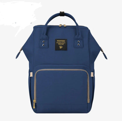 Multi-purpose large capacity mummy bag in blue, with a sleek backpack-inspired design and ample storage for parenting essentials