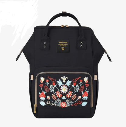 Multi-purpose large capacity mummy bag in blue, with a sleek backpack-inspired design and ample storage for parenting essentials