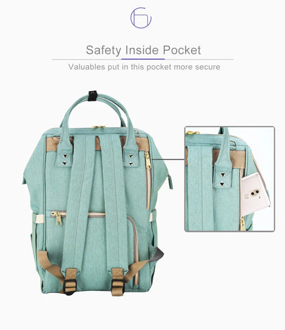 Multi-purpose large capacity mummy bag in blue, with a sleek backpack-inspired design and ample storage for parenting essentials