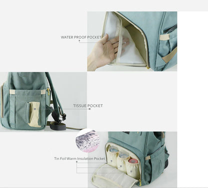 Multi-purpose large capacity mummy bag in blue, with a sleek backpack-inspired design and ample storage for parenting essentials