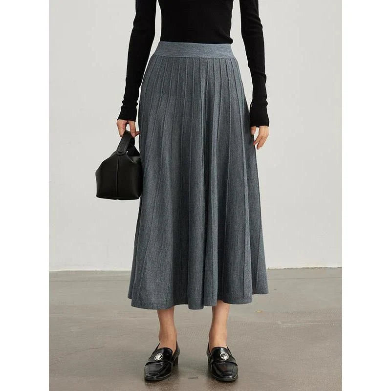 Elegant mid-calf pleated wool skirt in a rich chocolate colour, featuring a classic A-line silhouette and premium craftsmanship.