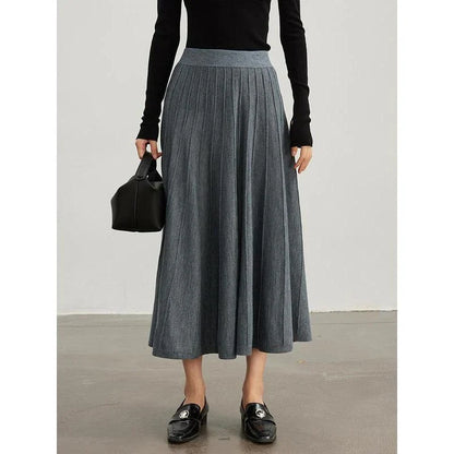 Elegant mid-calf pleated wool skirt in a rich chocolate colour, featuring a classic A-line silhouette and premium craftsmanship.