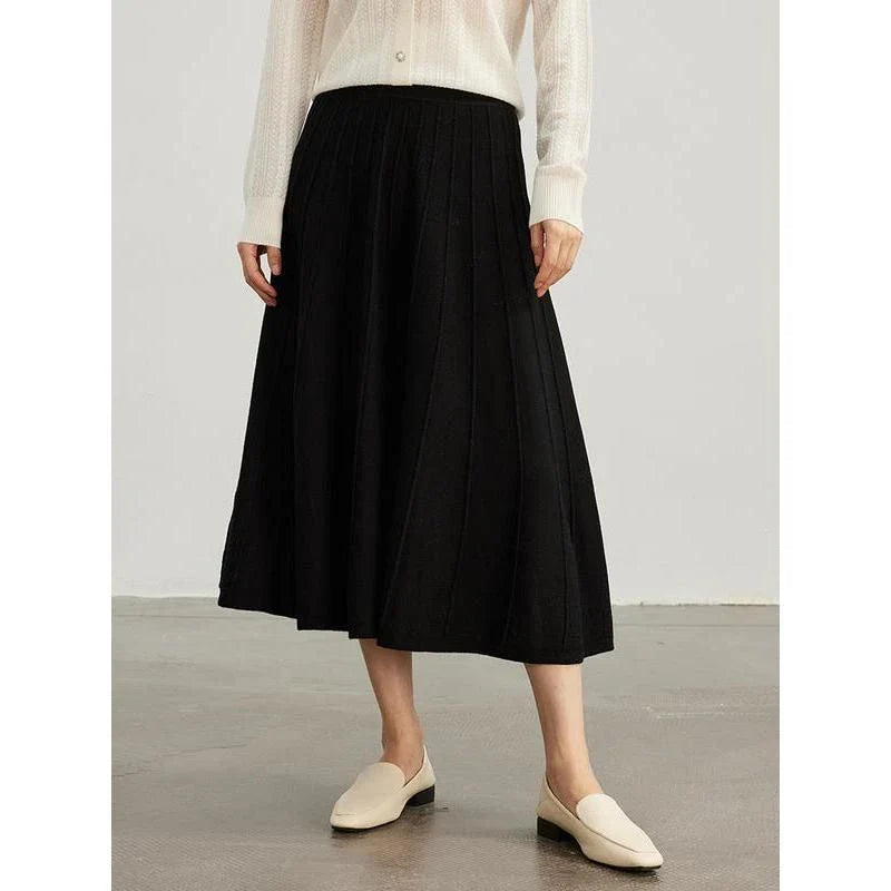 Elegant mid-calf pleated wool skirt in a rich chocolate colour, featuring a classic A-line silhouette and premium craftsmanship.