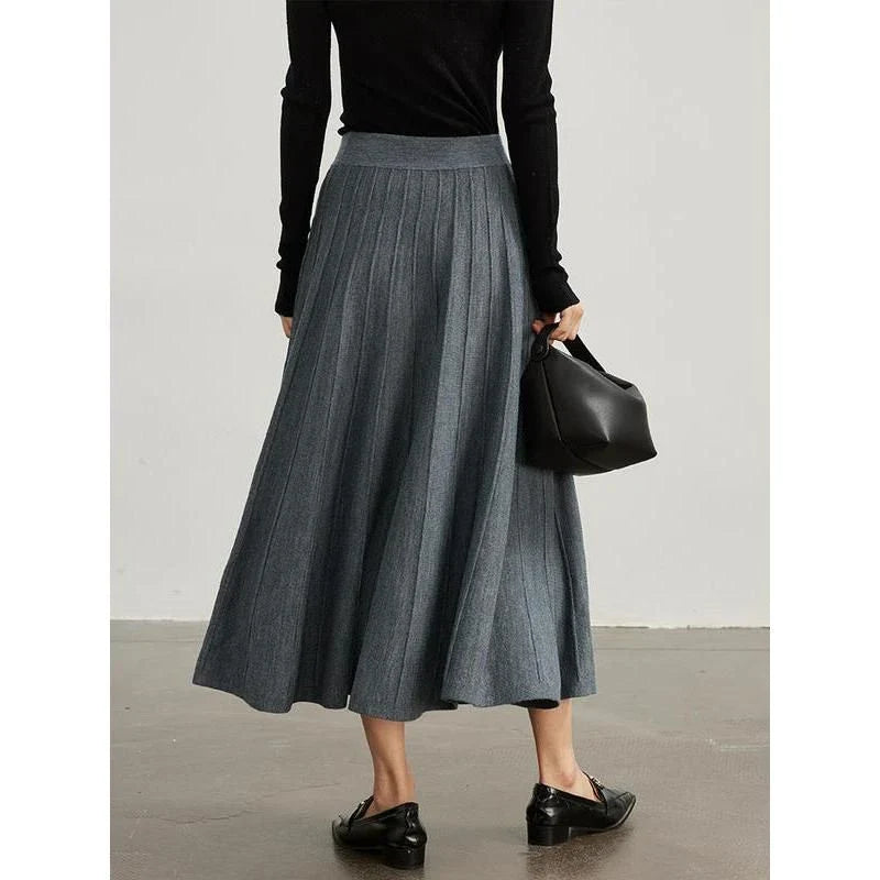 Elegant mid-calf pleated wool skirt in a rich chocolate colour, featuring a classic A-line silhouette and premium craftsmanship.