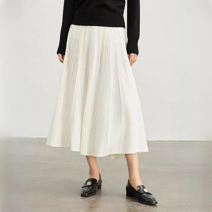 Elegant mid-calf pleated wool skirt in a rich chocolate colour, featuring a classic A-line silhouette and premium craftsmanship.