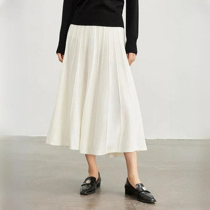 Elegant mid-calf pleated wool skirt in a rich chocolate colour, featuring a classic A-line silhouette and premium craftsmanship.