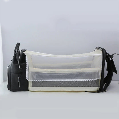PU Leather Diaper Bag Backpack in Black, featuring side pocket, anti-theft compartment, and stroller straps