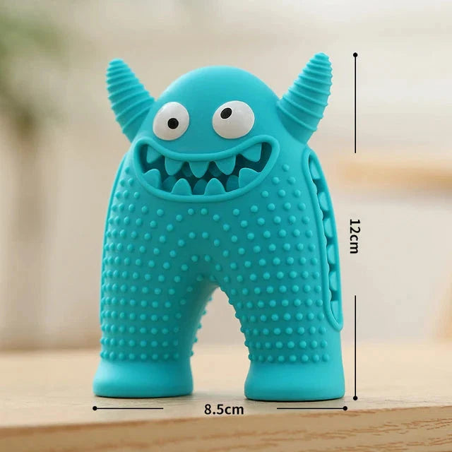 A cute interactive silicone dog toy shaped like a little monster, designed to clean teeth and promote dental health while providing entertainment.