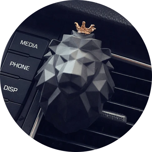 Crowned Lion Car Air Freshener with a majestic lion head design and sparkling crown, freshening the interior of a vehicle
