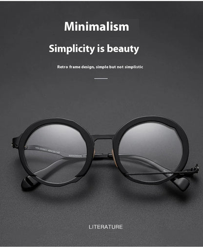 A close-up view of a premium fashion metal spectacle frame in black, white gold, and black gold colours.