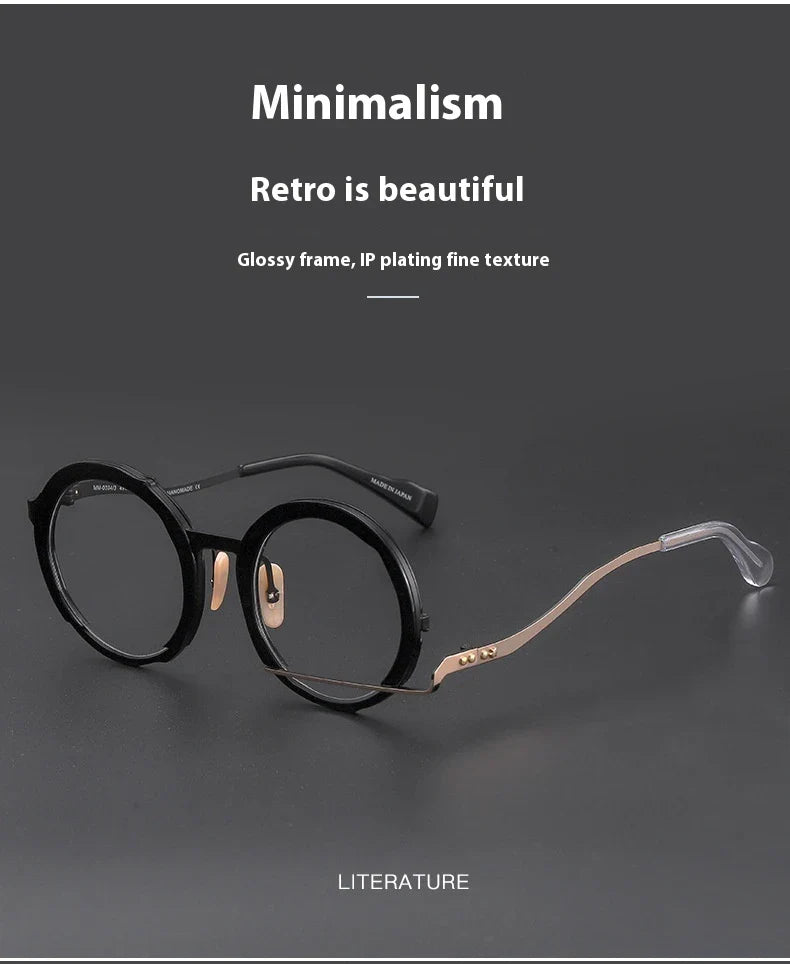 A close-up view of a premium fashion metal spectacle frame in black, white gold, and black gold colours.