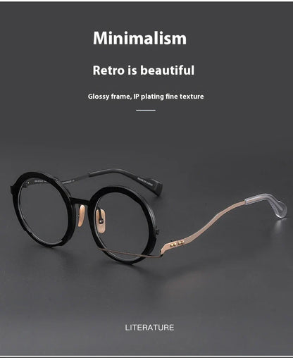 A close-up view of a premium fashion metal spectacle frame in black, white gold, and black gold colours.