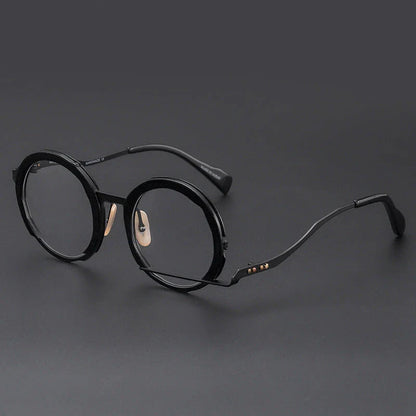 A close-up view of a premium fashion metal spectacle frame in black, white gold, and black gold colours.