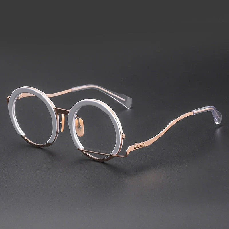 A close-up view of a premium fashion metal spectacle frame in black, white gold, and black gold colours.
