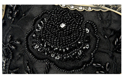 Elegant black bead embroidered cosmetic bag with a vintage-inspired design
