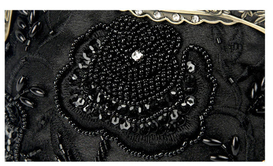 Elegant black bead embroidered cosmetic bag with a vintage-inspired design
