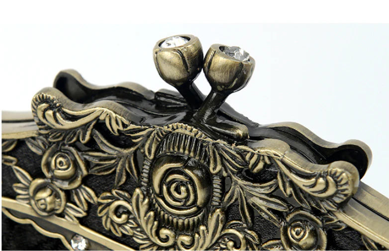 Elegant black bead embroidered cosmetic bag with a vintage-inspired design