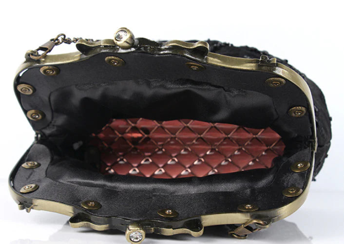 Elegant black bead embroidered cosmetic bag with a vintage-inspired design