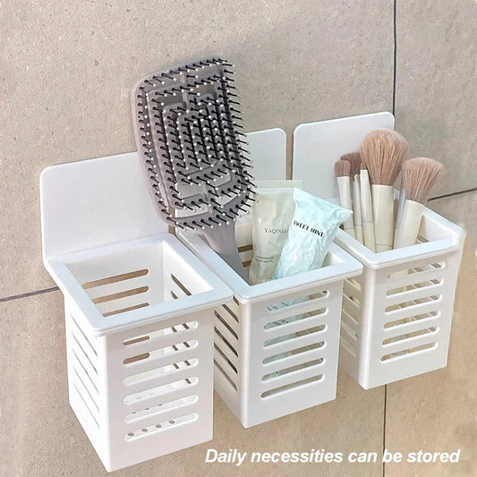 A white, wall-mounted toothbrush and cosmetic holder with a suction cup for easy installation