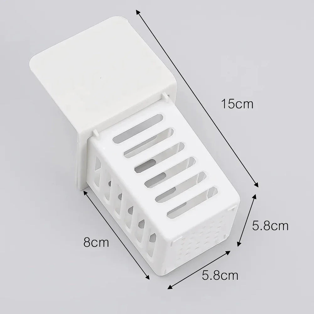 A white, wall-mounted toothbrush and cosmetic holder with a suction cup for easy installation