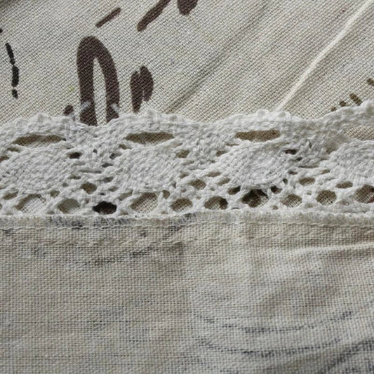 A decorative Paris-themed cotton and linen tablecloth featuring iconic landmarks and a romantic French design