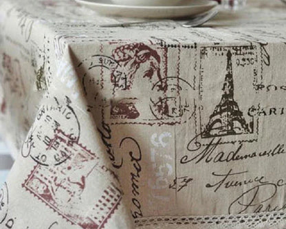 A decorative Paris-themed cotton and linen tablecloth featuring iconic landmarks and a romantic French design