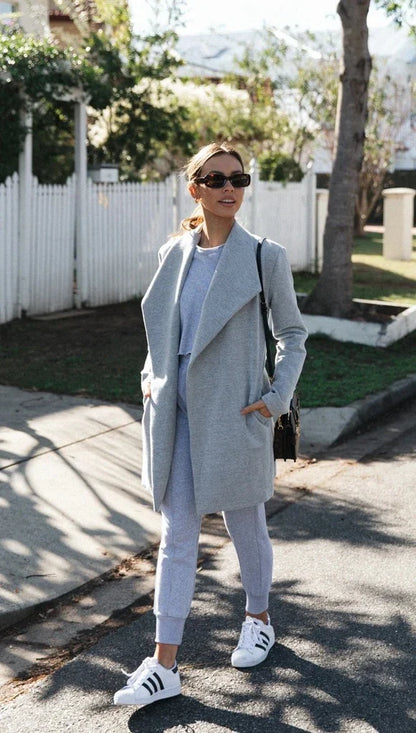 Premium polyester fibre trench coat in solid grey or black colour, with a timeless silhouette and flattering fit