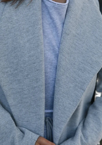 Premium polyester fibre trench coat in solid grey or black colour, with a timeless silhouette and flattering fit