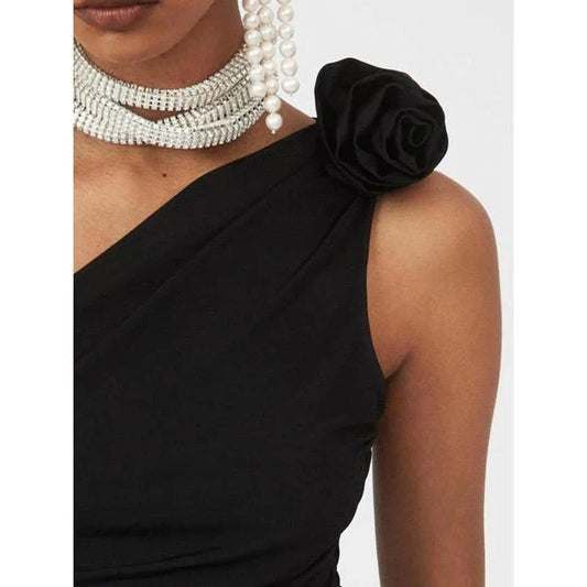 Chic black diagonal shoulder knit tank top with 3D rose detail, perfect for summer fashion