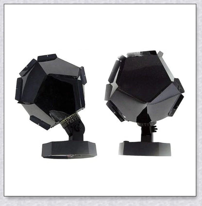 A star projector lamp casting a stunning display of stars and constellations across a bedroom wall