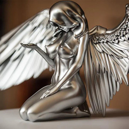 Elegant silver angel wings resin ornament with intricate feather detailing and a warm, ambient glow