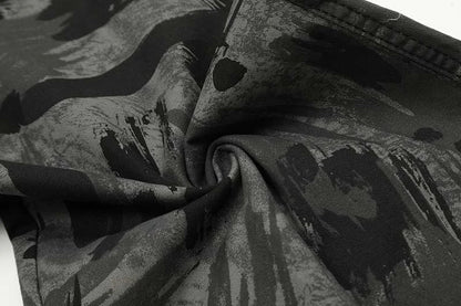 Graffiti-inspired camouflage print straight jeans for fashionable men and women