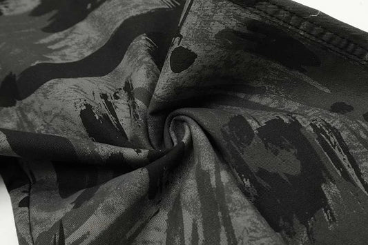 Graffiti-inspired camouflage print straight jeans for fashionable men and women