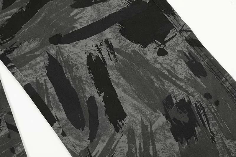 Graffiti-inspired camouflage print straight jeans for fashionable men and women